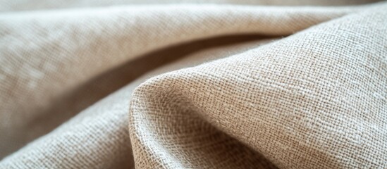 Poster - Textured beige fabric background close-up with folds detailed showing woven patterns and soft surface. Copy Space