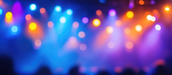 Poster - Abstract blurred background of colorful stage lights in blue, purple, and orange hues creating a vibrant atmosphere Copy Space