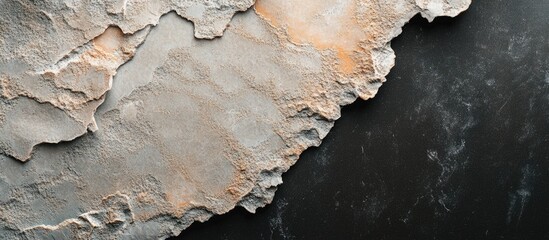 Poster - Textured surface of old gray stone with rough edges and subtle color variations on a dark background with Copy Space