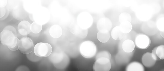 Poster - Abstract blurred background with soft white bokeh circles on grey tones ideal for creating a dreamy effect and showcasing text Copy Space