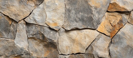 Poster - Textured natural stone wall background with various colors and shapes of irregularly arranged rocks Copy Space