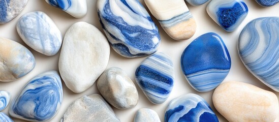 Poster - assorted blue and white polished stones texture background with smooth surfaces and various shapes i