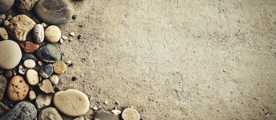 Poster - Textured surface with assorted pebbles arranged along the edge providing natural elements and ample copy space for design use.