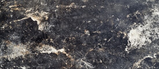 Poster - Dark textured stone surface with irregular patterns suitable for background use