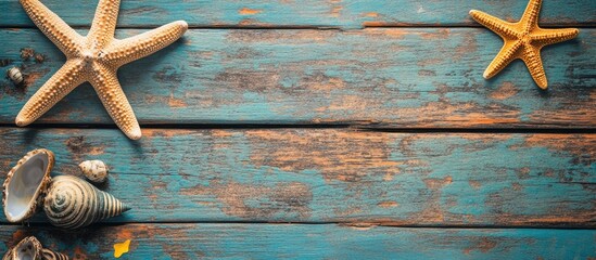 Poster - Starfish and seashells on rustic turquoise wooden background with copy space