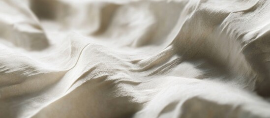 Poster - Textured fabric background in soft beige tones with gentle folds and ripples ideal for textile or design projects Copy Space
