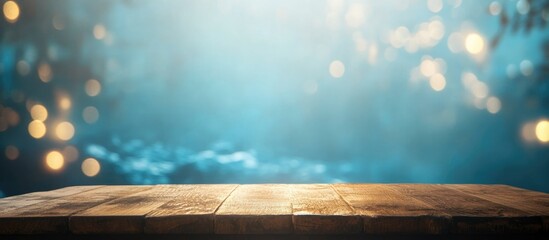Poster - Wooden table surface with blurred blue bokeh lights in background and copy space.