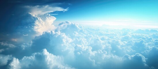 Poster - Aerial View of Expansive Cloudscape and Clear Blue Sky with Bright Sunlight
