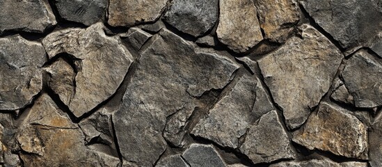 Poster - Close-up of irregular stone wall texture with uneven shapes and shades of gray