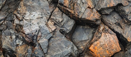 Poster - Close-up of rugged textured rocks with shades of gray and orange