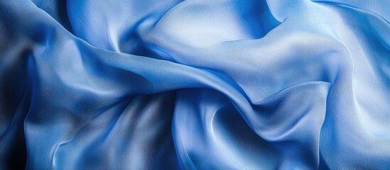 Poster - Blue silk fabric with smooth folds and flowing texture pattern