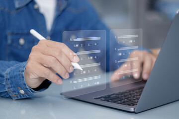 Poster - Man using pen to select correct answer for exam or questionnaire on computer , concept of online learning assessment for students who study at a distance using internet technology