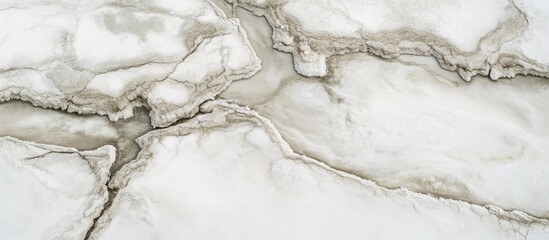 Poster - Abstract close-up of cracked and textured white marble surface with soft beige veins and patterns suitable for backgrounds or design projects.