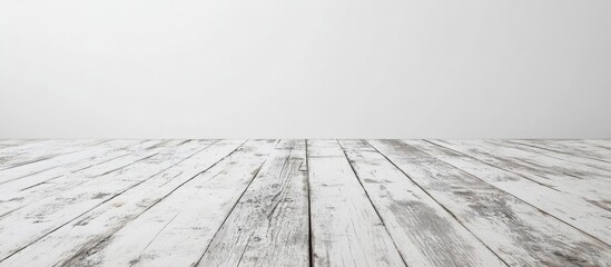 Fototapete - White wooden floor with weathered texture and light gray background featuring ample copy space for text placement.