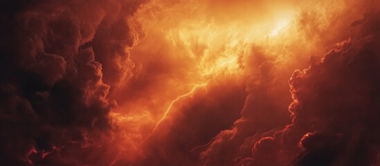 Poster - Dramatic stormy clouds illuminated by orange and yellow tones creating a fiery sky abstract background with Copy Space