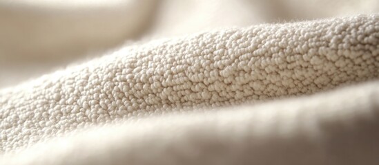Poster - Close-up texture of soft beige fabric with a detailed knitted pattern suitable for backgrounds and textile design Copy Space