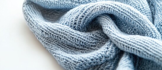 Poster - Blue knitted fabric texture with a twisted appearance on a light background suitable for textile design Copy Space