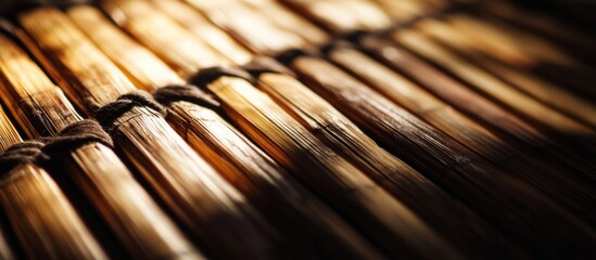 Poster - Close-up of woven bamboo or straw mat with warm light reflections and shadows showcasing natural texture and patterns Copy Space