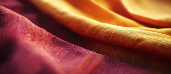 Poster - Elegant folds of colorful silk fabric in purple and orange hues with soft texture and lighting showing delicate details Copy Space