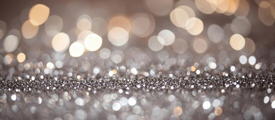 Poster - Soft focus background of shimmering silver bokeh lights with glittering texture and highlights Copy Space