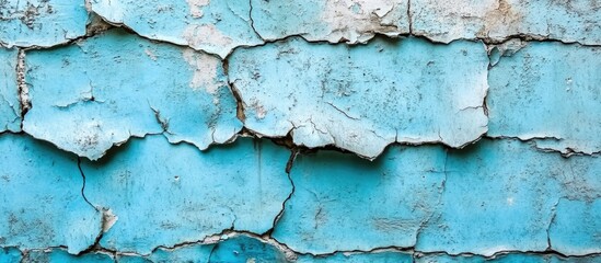 Poster - Weathered blue peeling paint on a textured wall with cracks and imperfections ideal for backgrounds and textures Copy Space