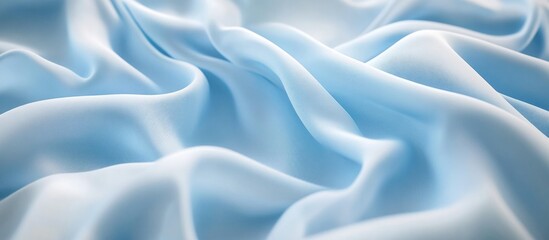 Poster - Light blue wrinkled fabric texture background with soft folds and drapes suitable for textile design or fashion themes Copy Space