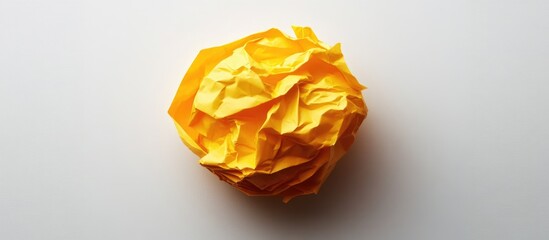 Aufkleber - Crumpled yellow paper ball on a white background with copy space for text placement