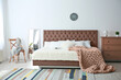 © New Africa - Cozy bedroom interior with mocha mousse shade. Trendy color of 2025 year