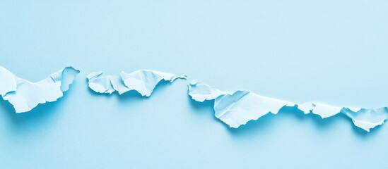 Aufkleber - Torn blue paper texture on light blue background with space for text or design elements in horizontal orientation