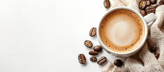 Aufkleber - Cup of coffee with coffee beans on a textured fabric background and white surface with Copy Space