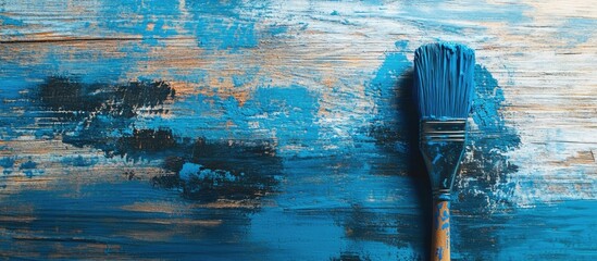 Aufkleber - Blue textured background with paint brush on wooden surface Copy Space