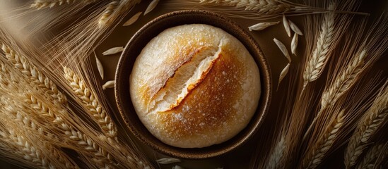 Aufkleber - Artisan bread in a rustic bowl surrounded by wheat stalks on a dark background Copy Space