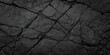 © Armin - Volumetric rock texture with cracks. Black stone background with copy space for design. Wide banner.