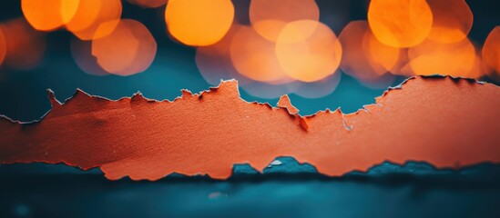 Aufkleber - Colored paper tear with blurred bokeh lights in the background creating a visual contrast and depth suitable for design projects with copy space