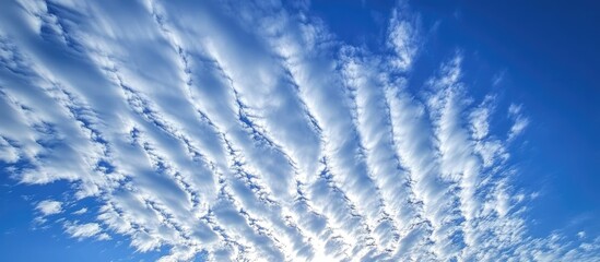 Aufkleber - Cloud formation with rippled texture in a clear blue sky showcasing intricate natural patterns and light effects. Copy Space