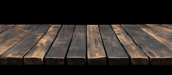Poster - Wooden planks background texture with dark tones and natural grain patterns on black backdrop ideal for product display Copy Space