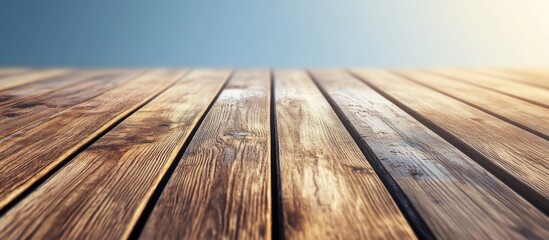 Wall Mural - Wooden floor texture with natural grains and sunlight reflection against a blue gradient sky Copy Space