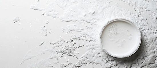 Poster - White powder on a flat surface with a ceramic plate in the center creating a clean and minimalist composition Copy Space