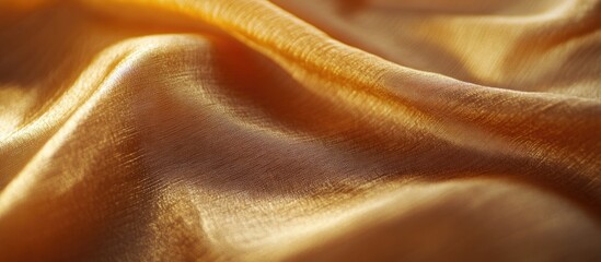Poster - Close-up of smooth golden silk fabric with gentle folds and texture ideal for background or textile design Copy Space