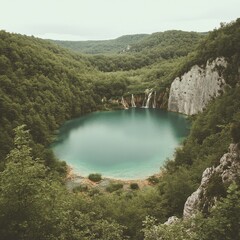 Sticker - A quiet lake mirrors the rich green landscape of mountains and trees