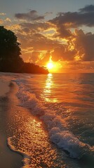 Poster - As the sun descends on the horizon, golden rays dance on gentle waves, creating a mesmerizing display of colors reflected on the water's surface and sandy shore