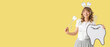 © Pixel-Shot - Tooth Fairy with wand and paper figure on yellow background