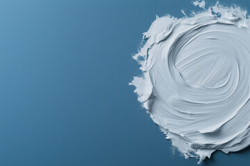Poster - Creative process of applying white paint on a vibrant blue background in a studio