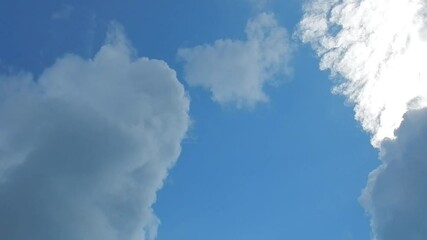 Poster - Blue sky and different types of white and rainy grey clouds, sunlight and plane in flight with white streak during spring weather - natural sky background. Topics: air transport, travel, airline