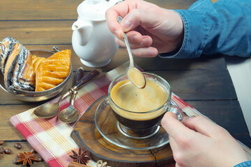 Wall Mural - Coffee beans in the hands of an elderly man. Close-up.