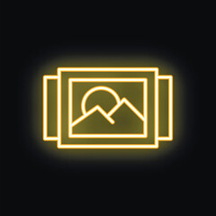 Poster - Neon yellow icon of a picture frame containing a mountain landscape glowing on a black background