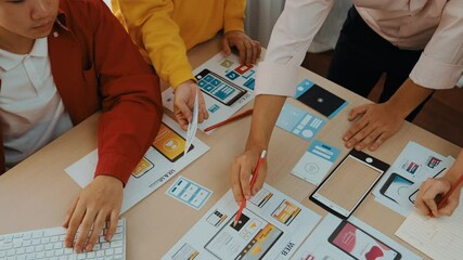 Poster - top view panorama video of startup company employee planning on user interface prototype for mobile 