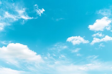 Bright blue sky with fluffy white clouds on a clear day