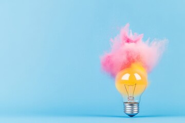 Wall Mural - Colorful explosion of powder over light bulb against blue background