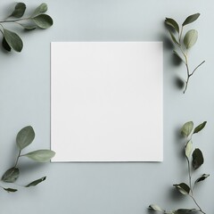 Fototapete - Blank square paper surrounded by green leaves on a soft blue background in a minimalist style setting. Generative AI